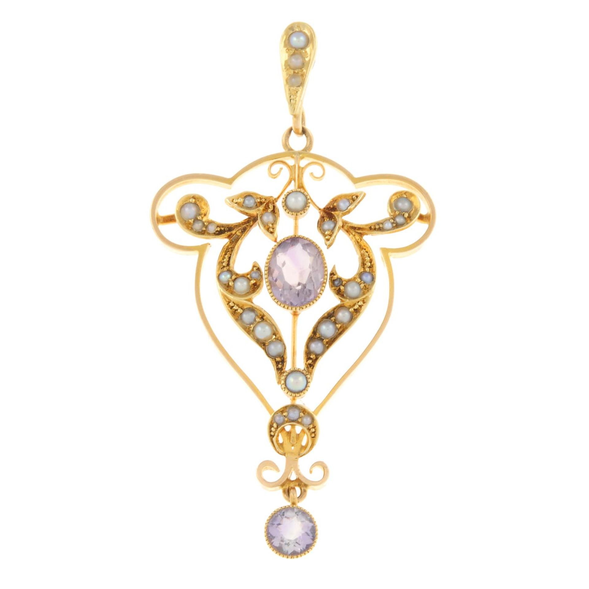 An early 20th century 15ct gold amethyst and split pearl pendant.Stamped 15ct.Length 5.2cms.