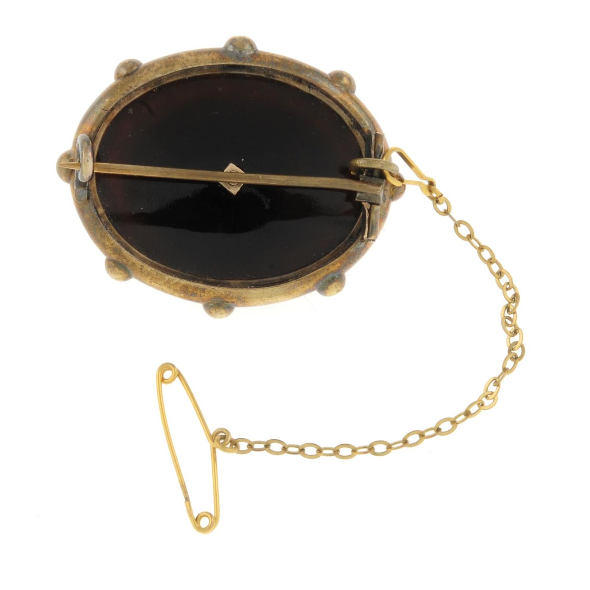 A late 19th century gold banded agate and split pearl brooch.Length 3.6cms. - Image 2 of 2