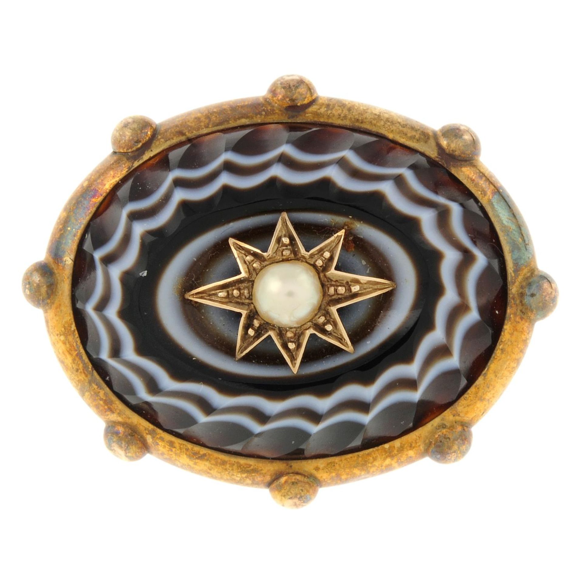 A late 19th century gold banded agate and split pearl brooch.Length 3.6cms.