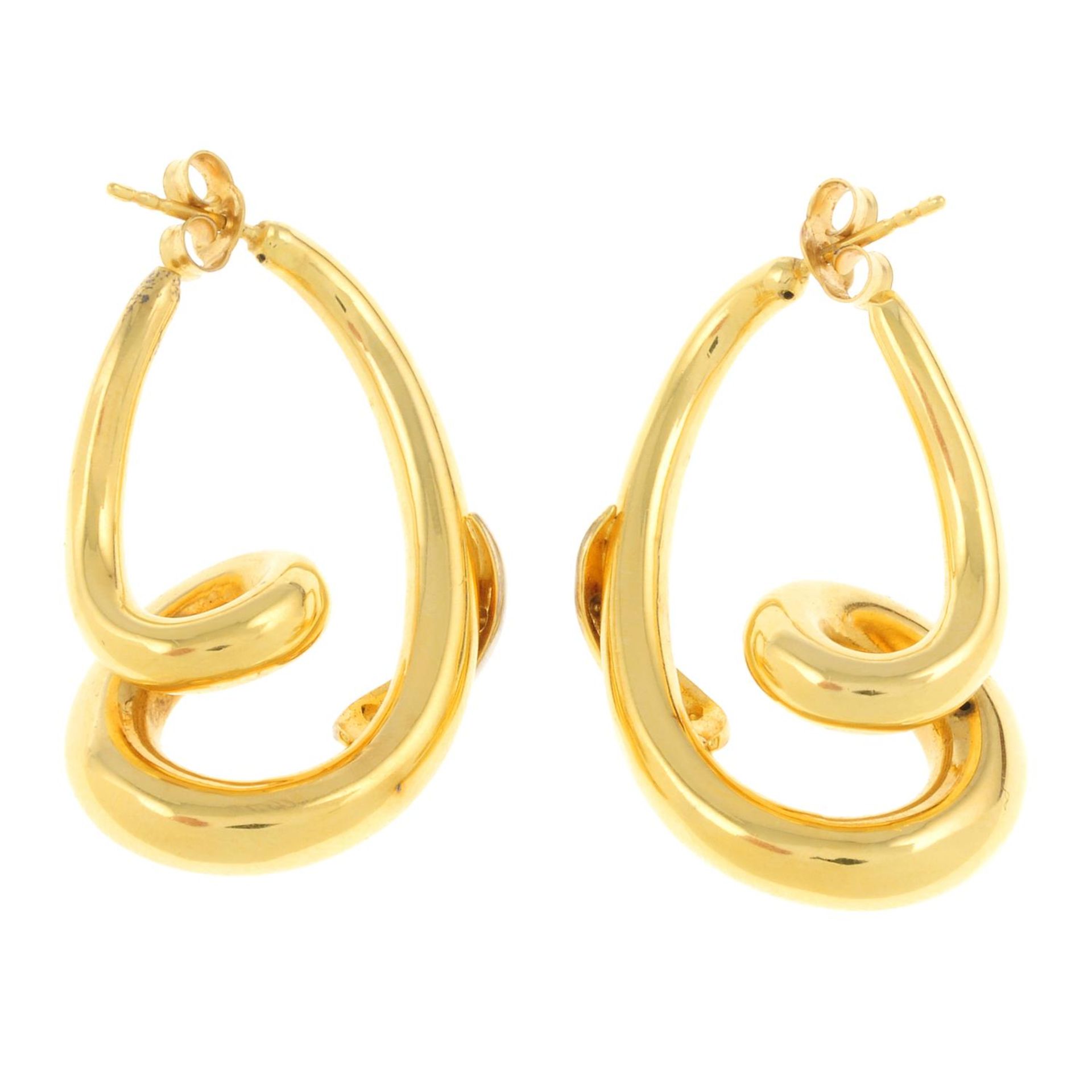 A pair of spiral earrings, with diamond accents. - Image 2 of 2