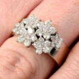 A 'pink' diamond and diamond scattered floral cluster ring.Total diamond weight 1.10cts,