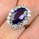 A tanzanite and brilliant-cut diamond cluster ring.Tanzanite calculated weight 6.45cts,