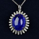 A tanzanite cabochon and diamond floral cluster pendant, with chain.