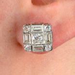 A pair of vari-cut diamond cluster earrings.