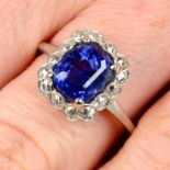 A mid 20th century platinum Sri Lankan sapphire and old-cut diamond cluster ring.With report