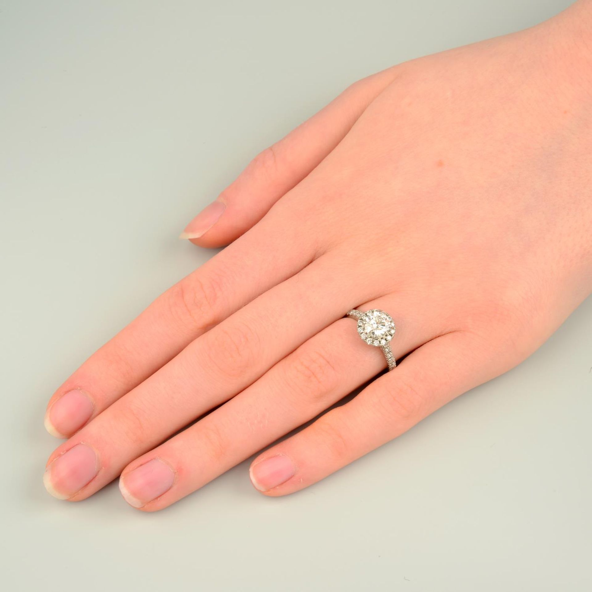 A platinum brilliant-cut diamond halo cluster ring. - Image 3 of 7