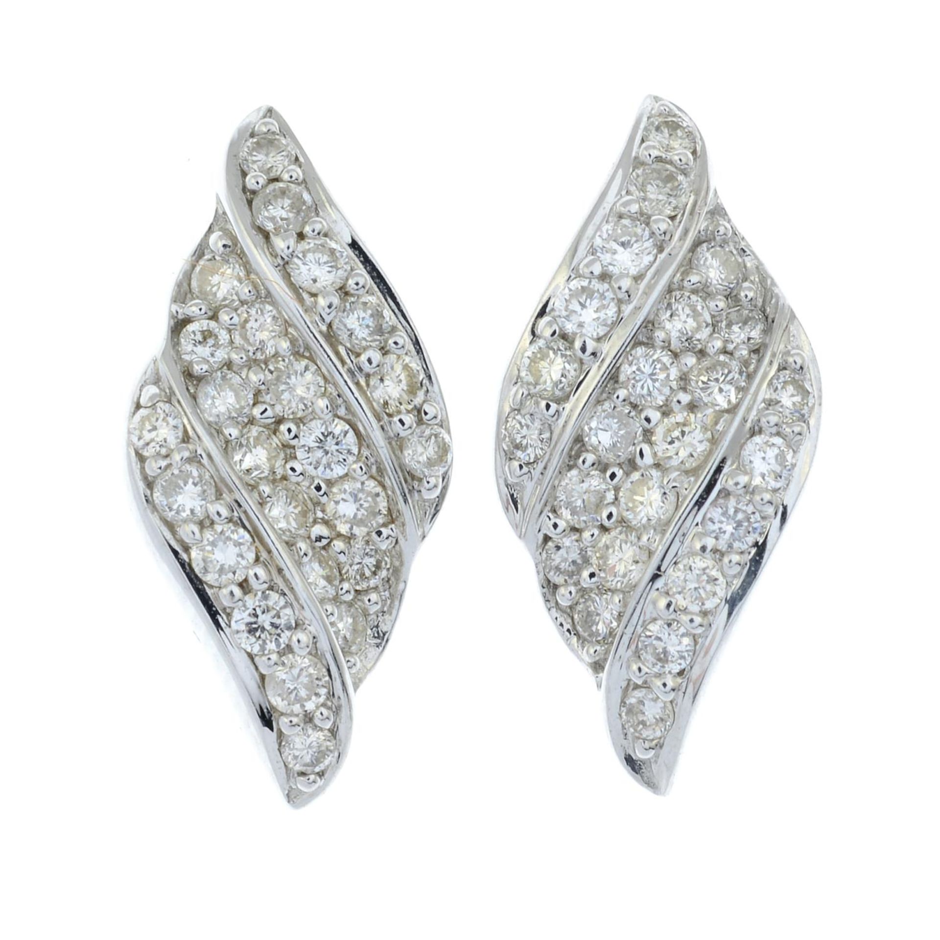 A pair of 18ct gold brilliant-cut diamond scroll motif earrings.Total diamond weight 0.55ct, - Image 2 of 3