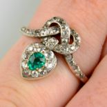 A late Victorian silver and gold, emerald and diamond heart and lover's knot ring.