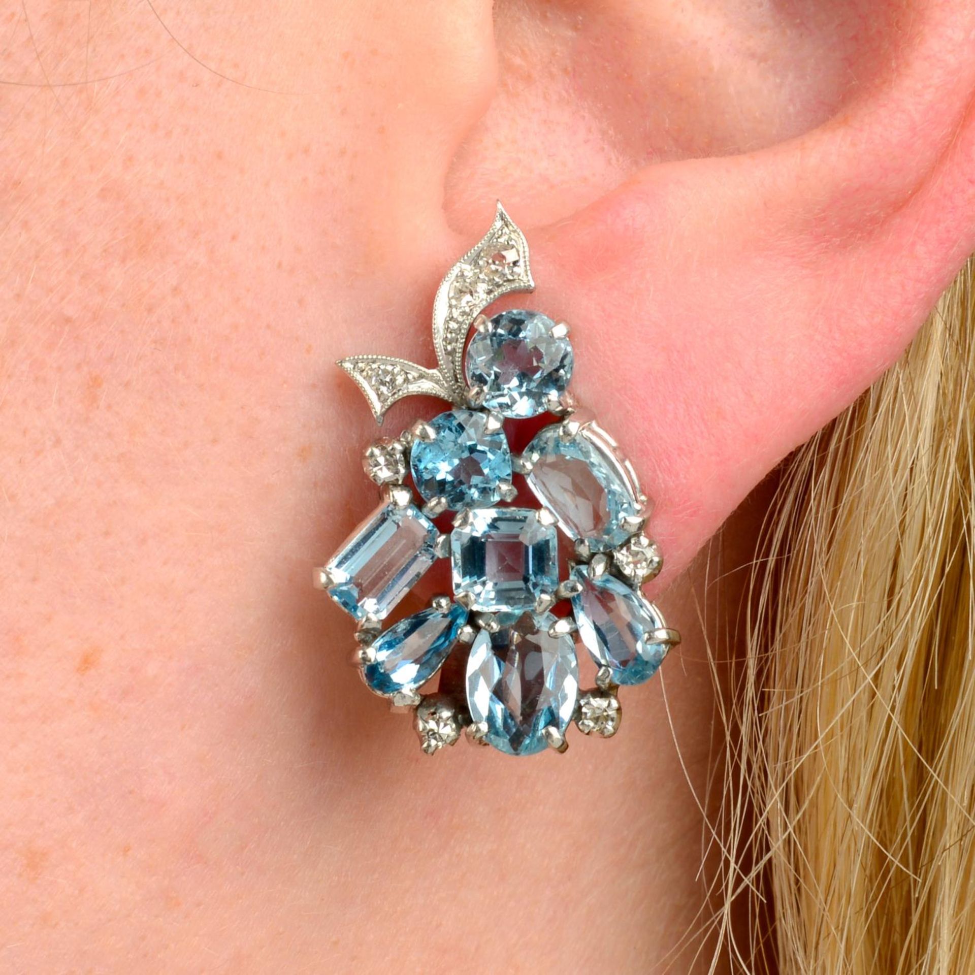 A pair of mid 20th century palladium vari-shape aquamarine and diamond earrings.
