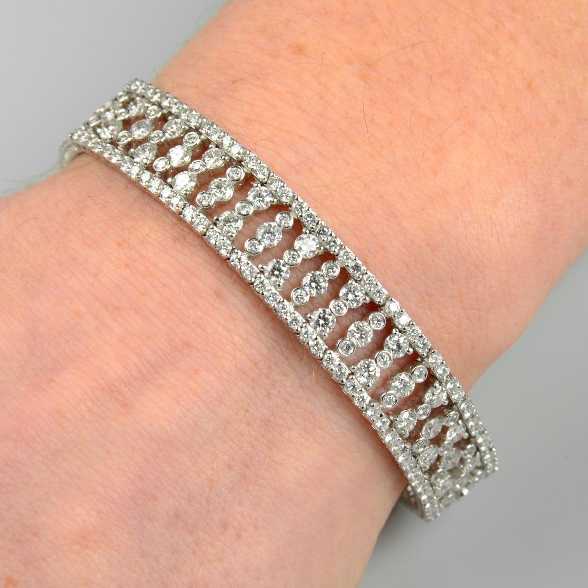 An 18ct gold brilliant-cut diamond bracelet.Total diamond weight 10.18cts,