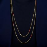 An early 20th century 15ct gold longuard chain necklace, with seed pearl and enamel spacers.