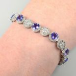 An 18ct gold tanzanite and diamond cluster bracelet.Tanzanite total weight 9.24cts.Total diamond