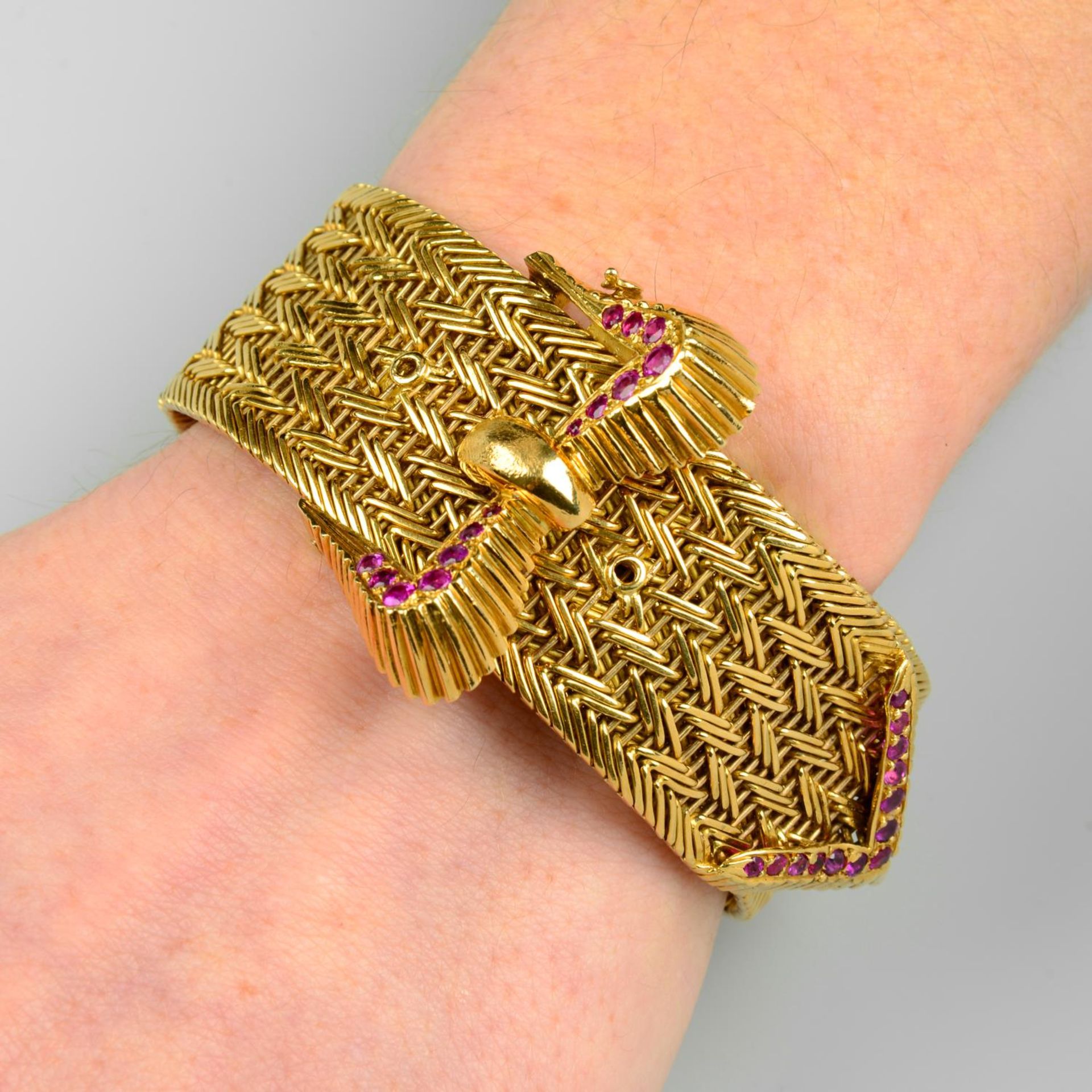 A 1960s 18ct gold ruby buckle bracelet, by Kutchinsky.Hallmarks for London, 1969.