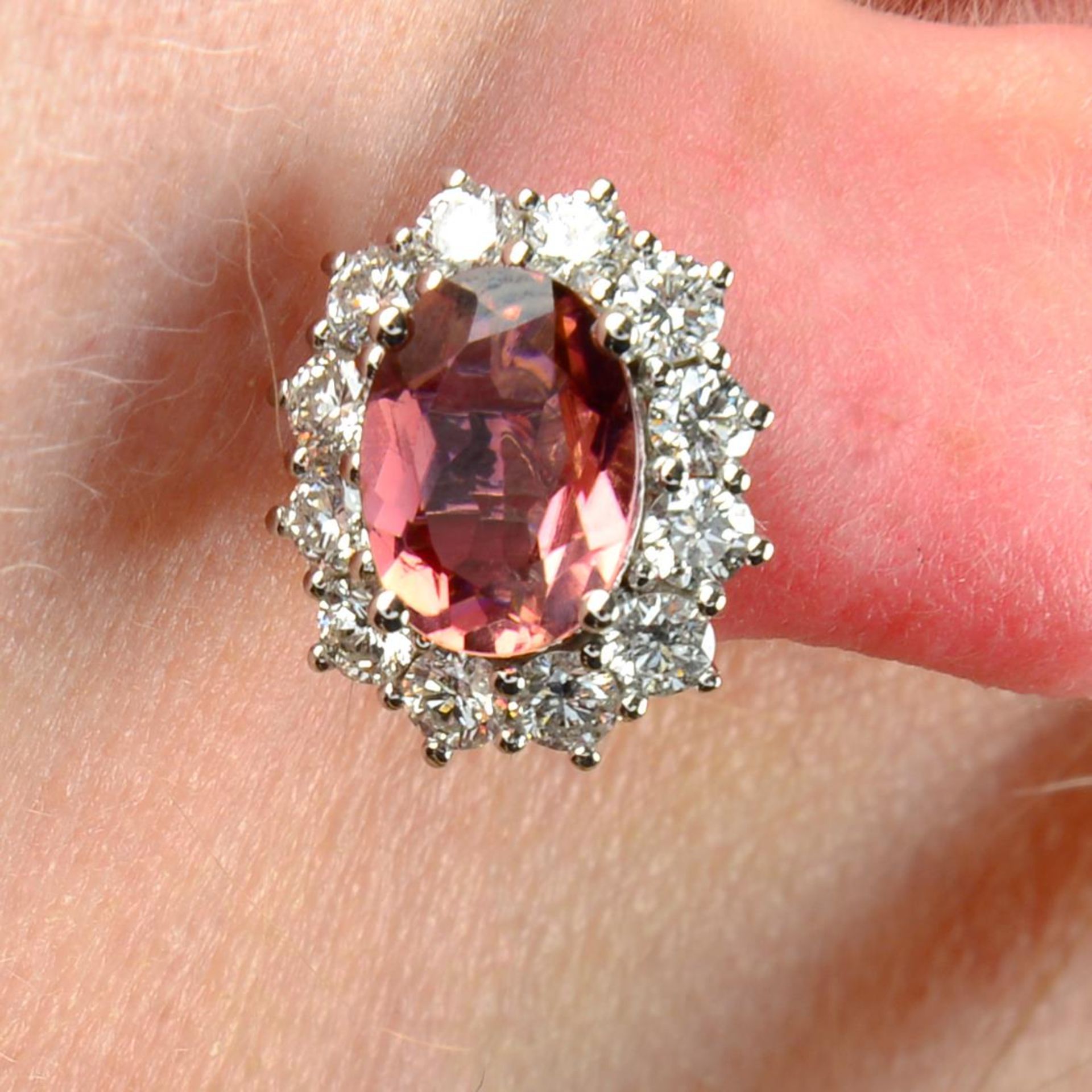 A pair of 18ct gold pink tourmaline and brilliant-cut diamond cluster earrings.Total tourmaline