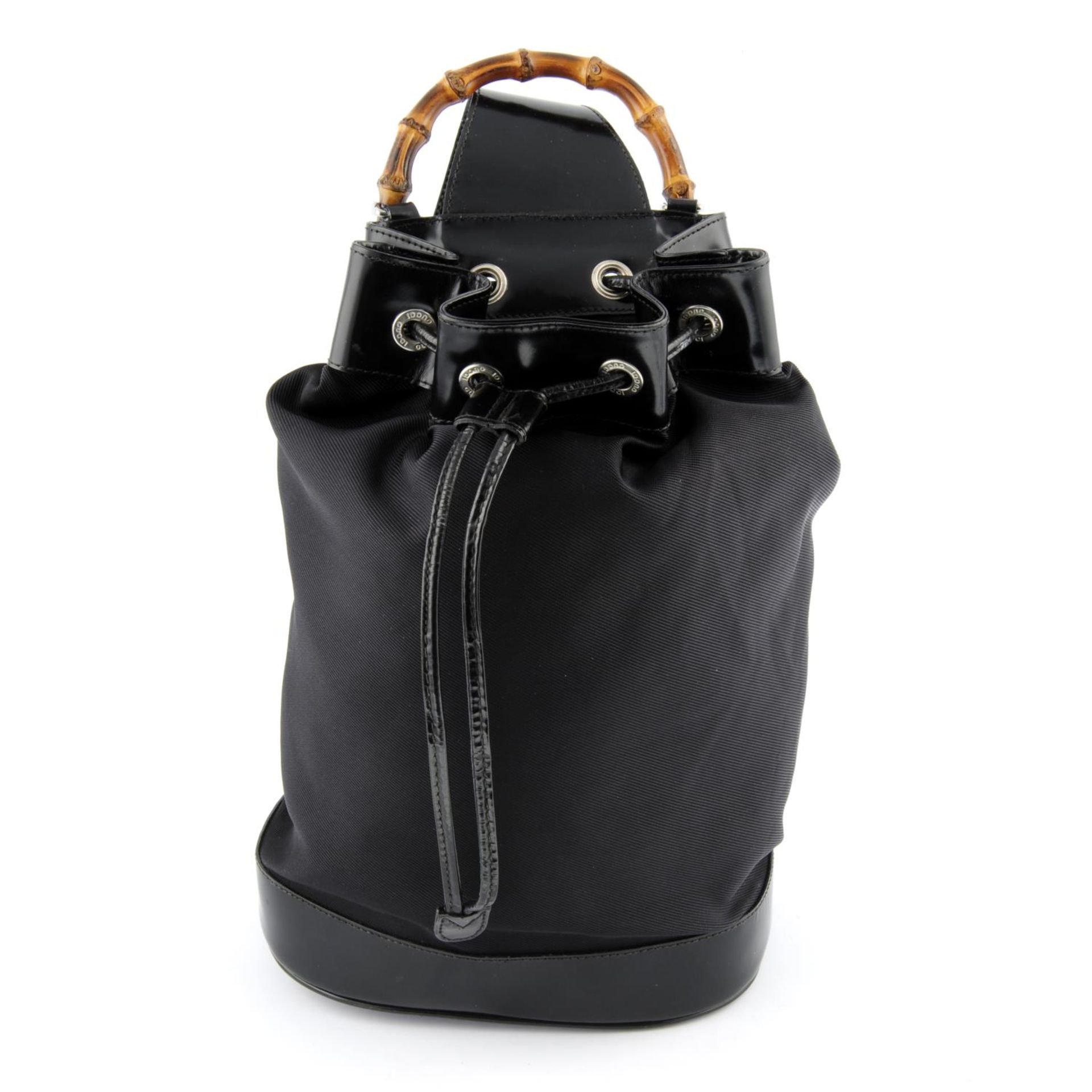 GUCCI - a black nylon and patent leather Bamboo handbag.