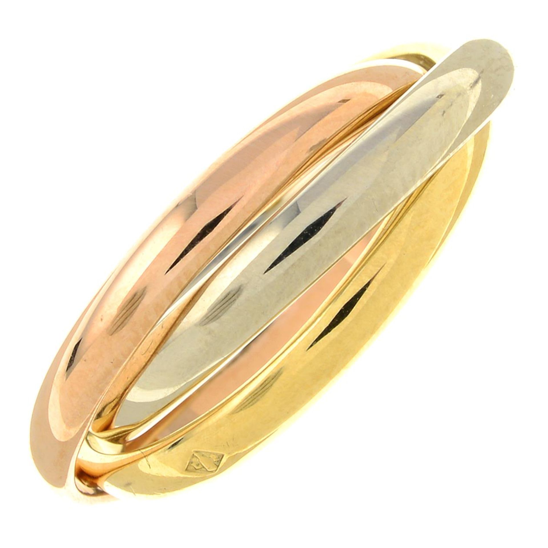 CARTIER - A 'Trinity' ring.French assay marks, stamped 750.