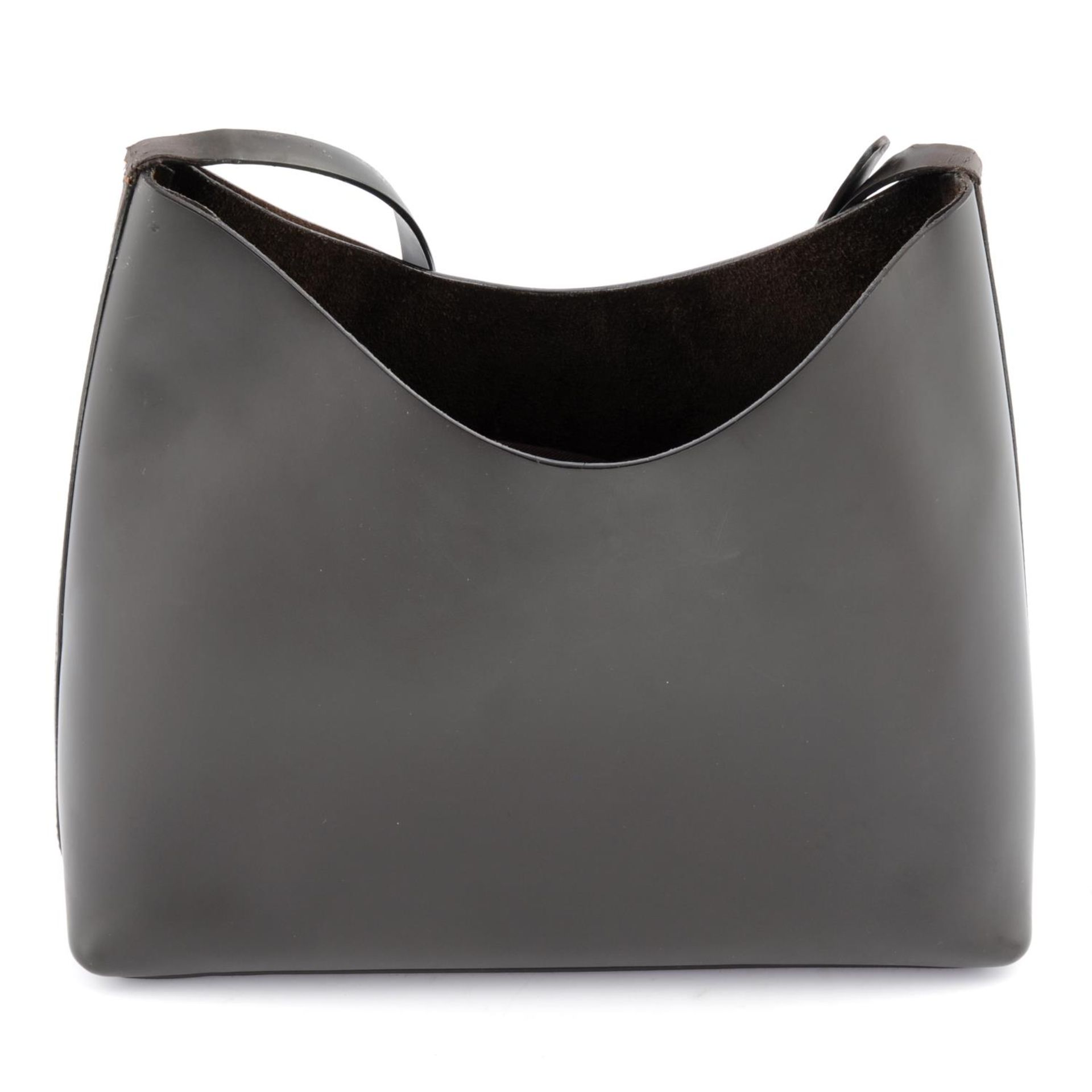 GUCCI - a brown leather handbag.
