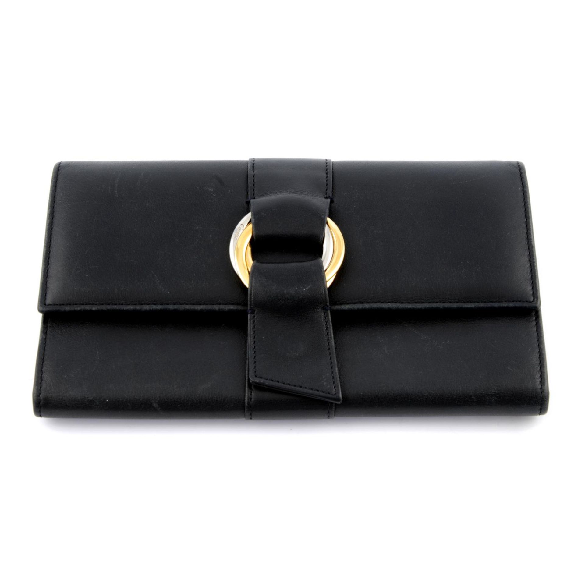 CARTIER - a black leather tri fold Trinity wallet.