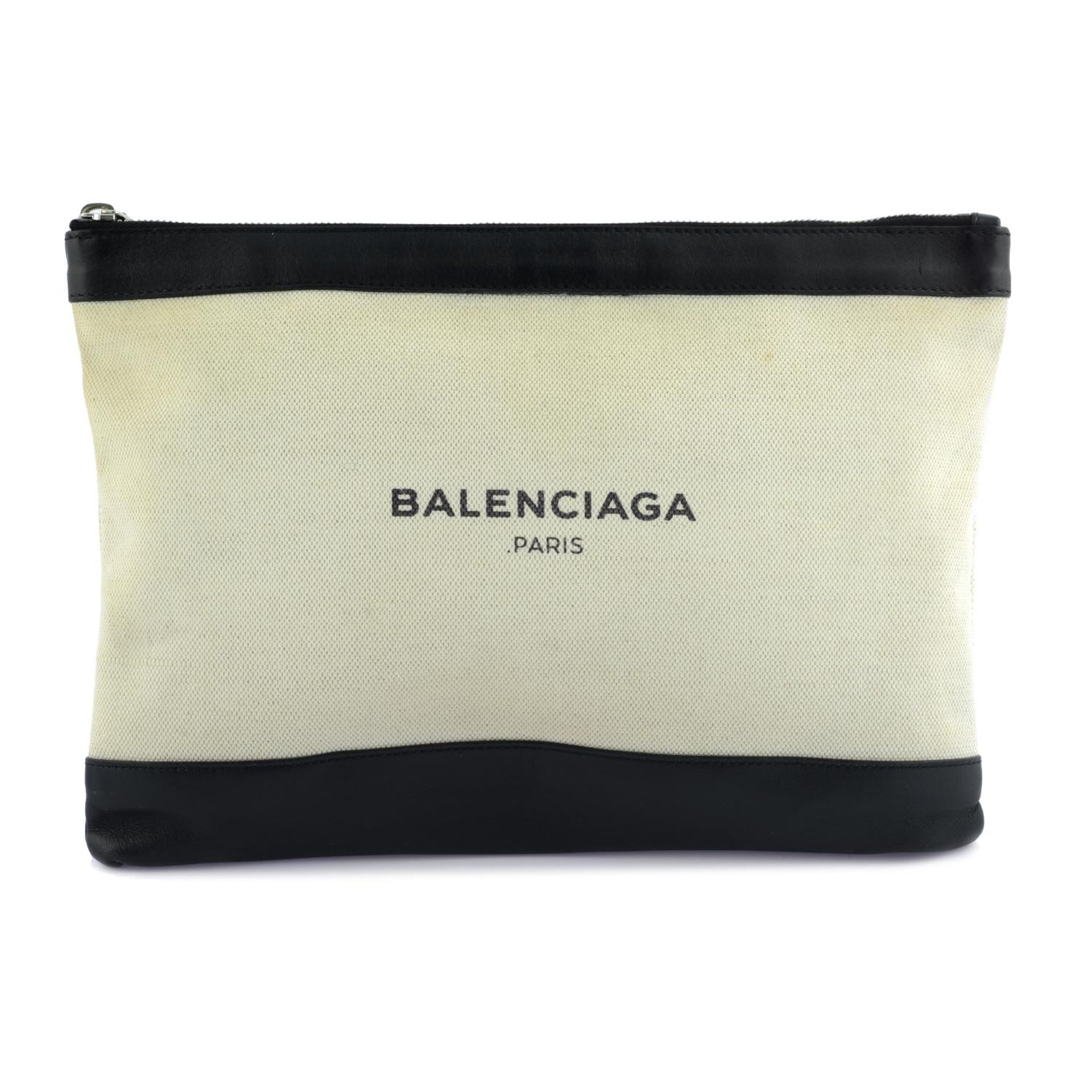 BALENCIAGA - a canvas and leather clutch.