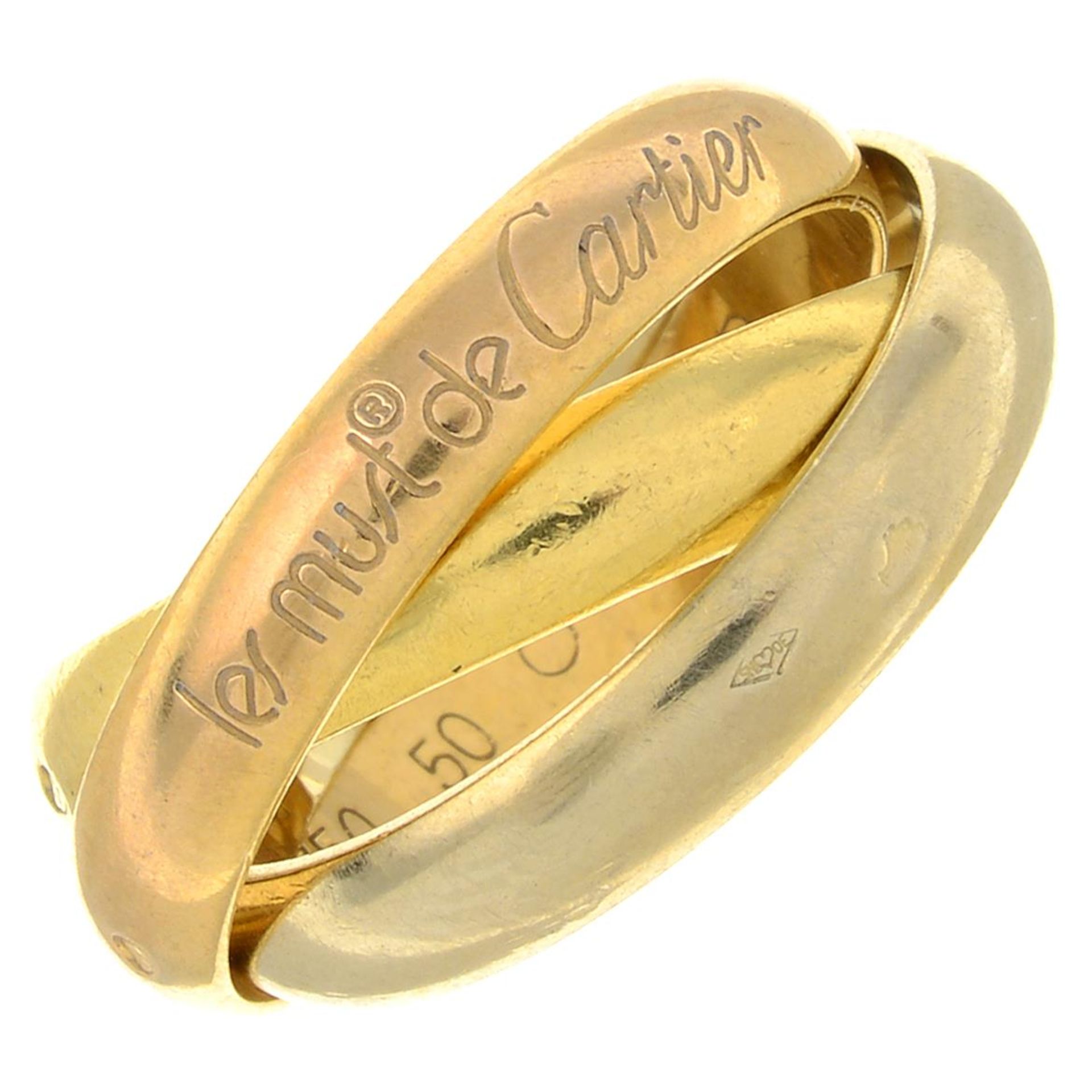 CARTIER - A 'Trinity' ring, by les must de Cartier.French assay marks, stamped 750.