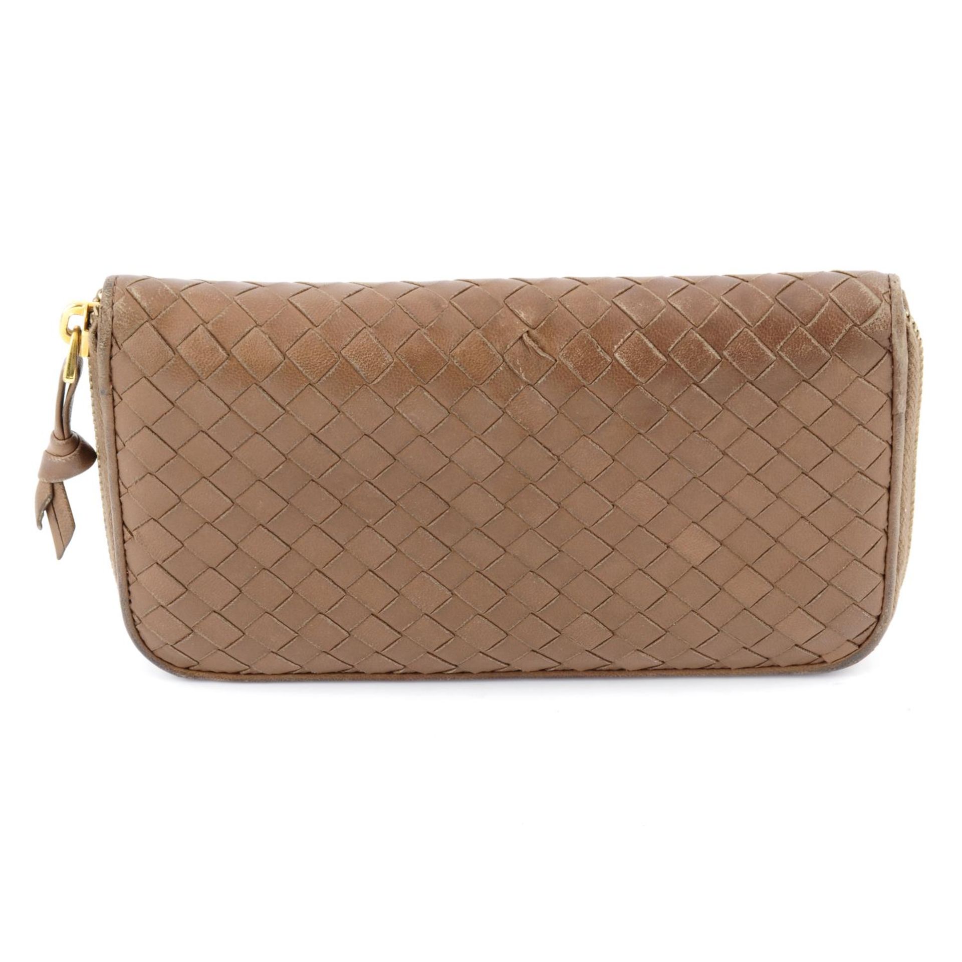 BOTTEGA VENETA - an Intrecciato leather Zippy wallet.