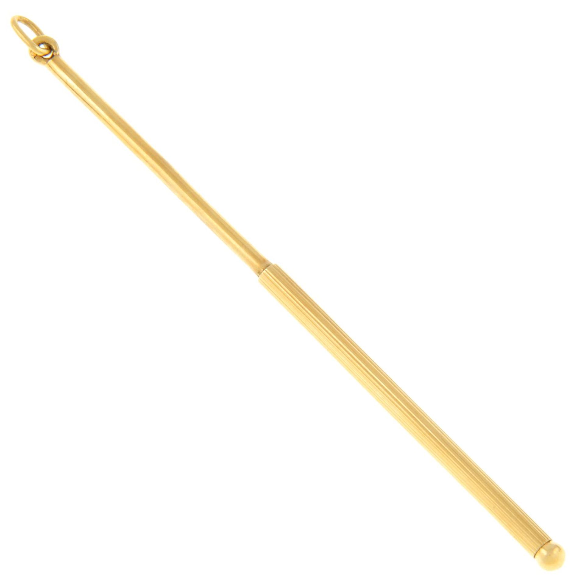 An early 20th century gold cocktail stirrer.Stamped 18k.Length 9.5cms.