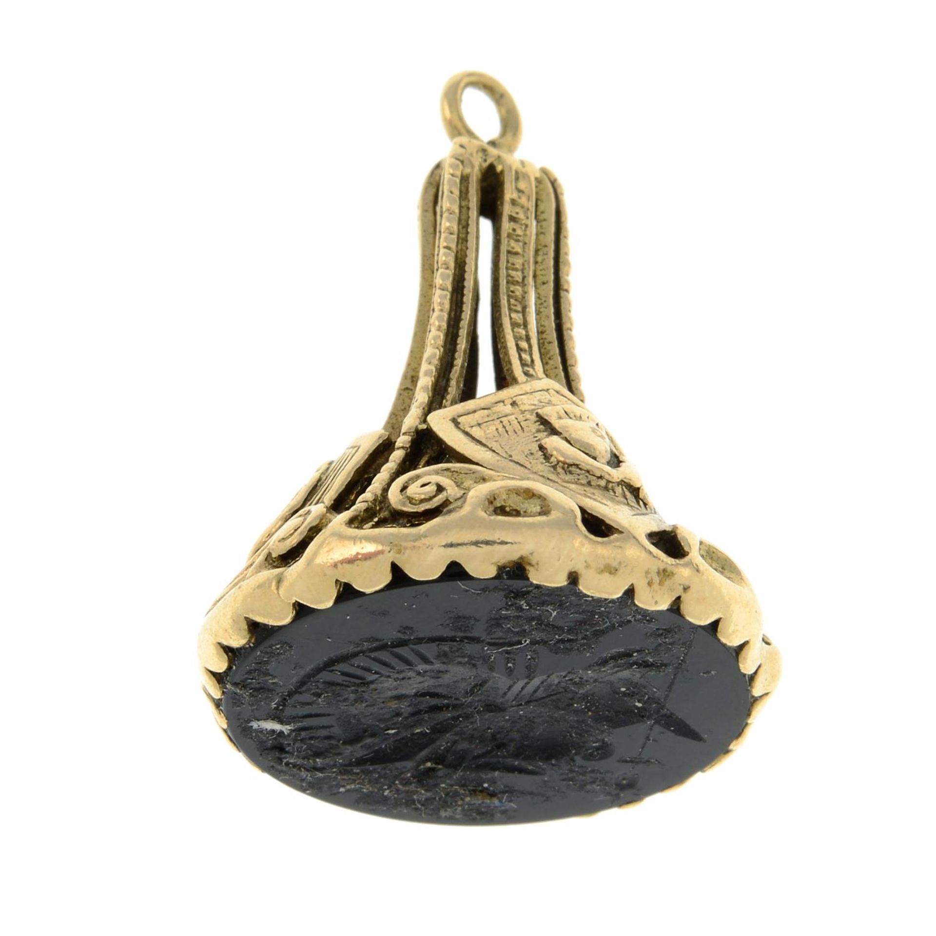 A 1970s 9ct gold onyx fob.Hallmarks for London, 1972.