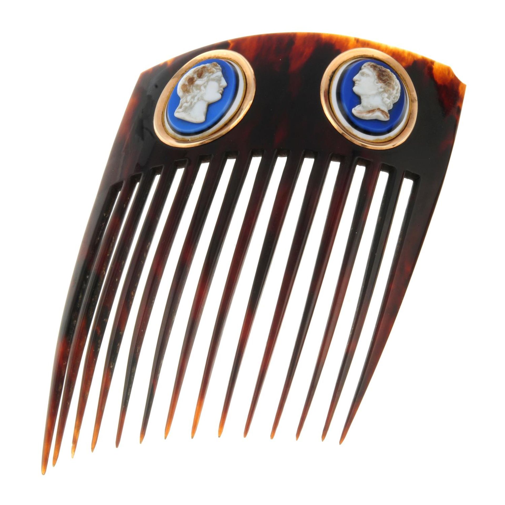 A tortoise shell comb, with paste cameo highlights.Length 13cms.