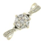 An 18ct gold diamond cluster ring.Total diamond weight 0.25ct, stamped to band.