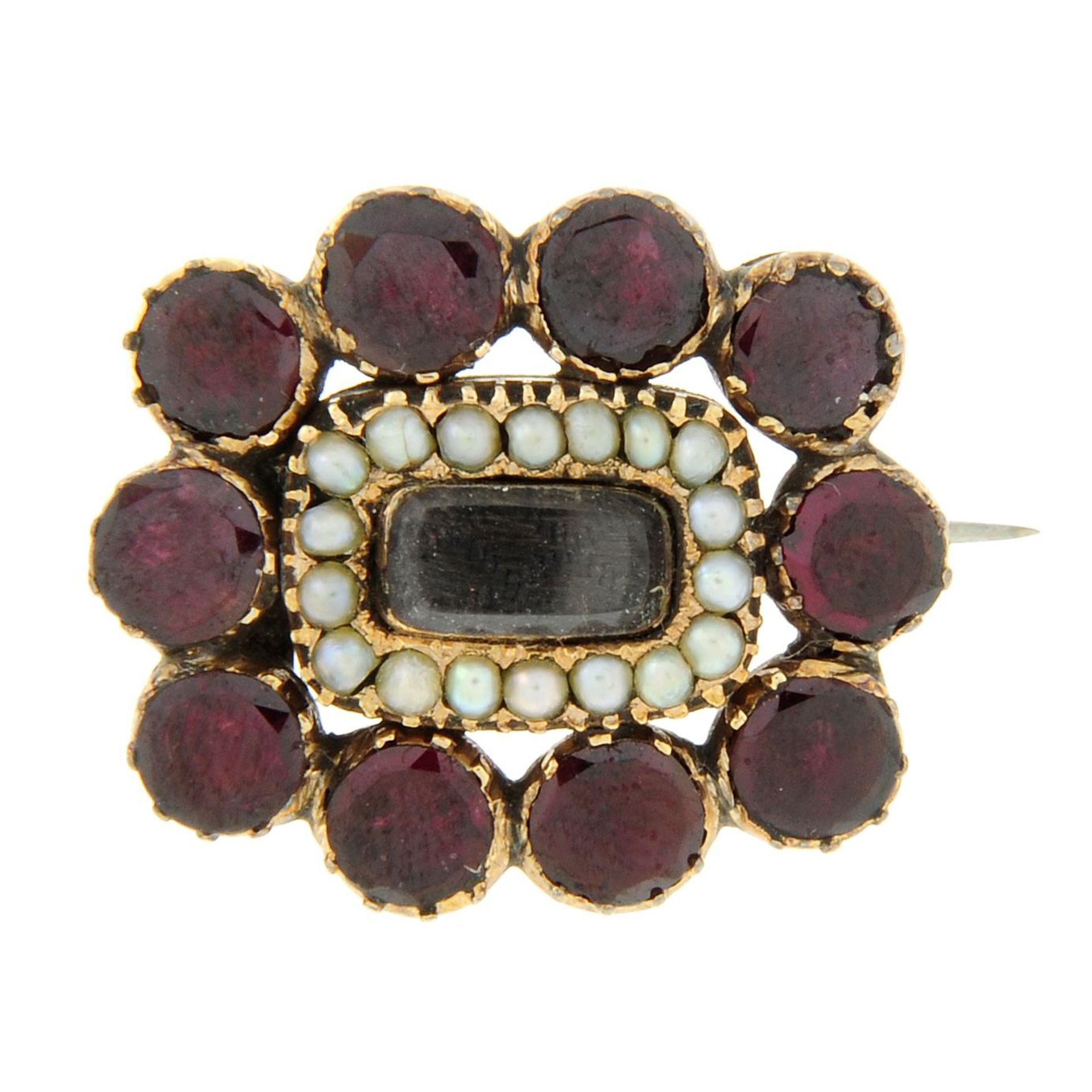 An early 19th century garnet and split pearl mourning brooch.Length 2.4cms.