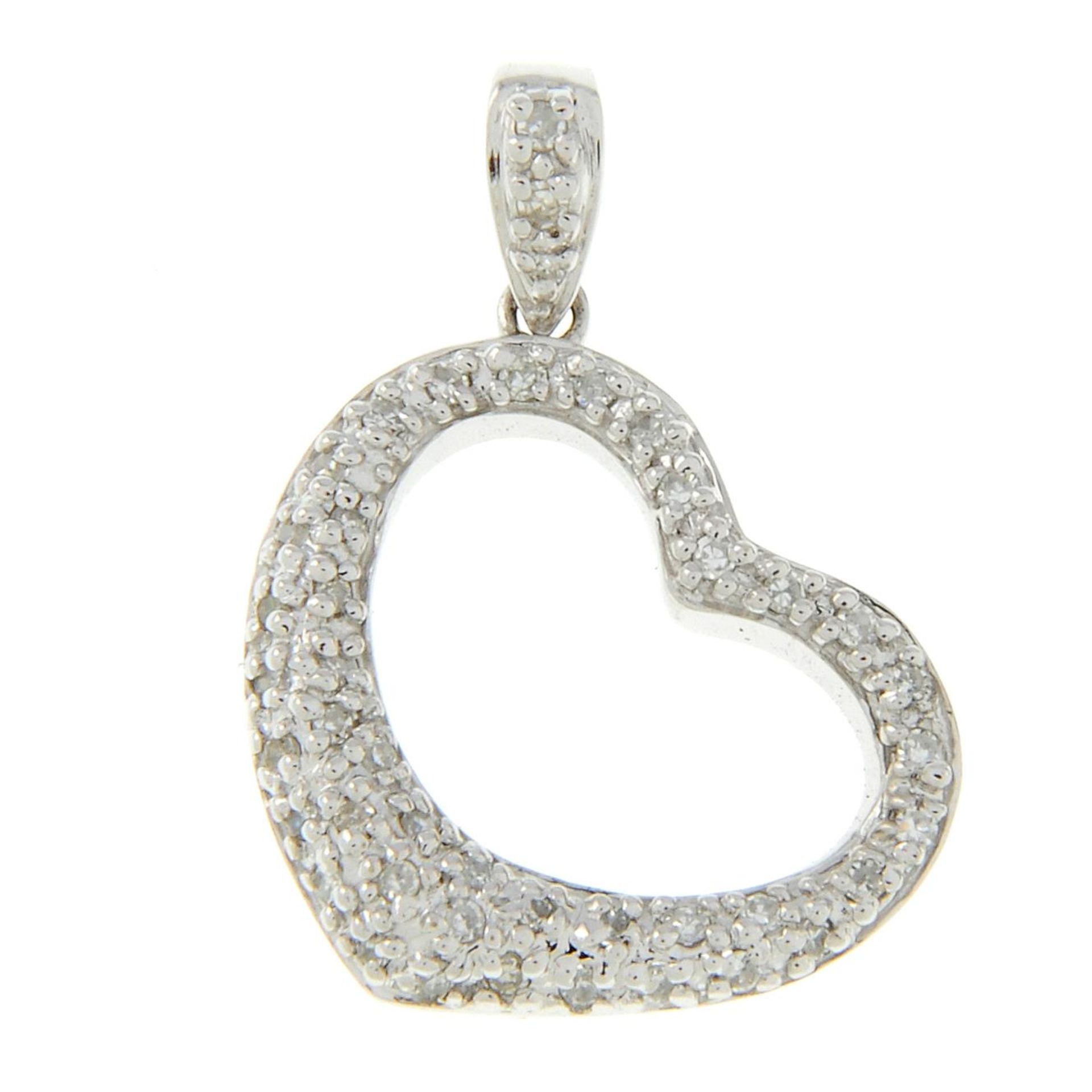 A 9ct gold pave-set diamond heart pendant.Total diamond weight 0.27ct,