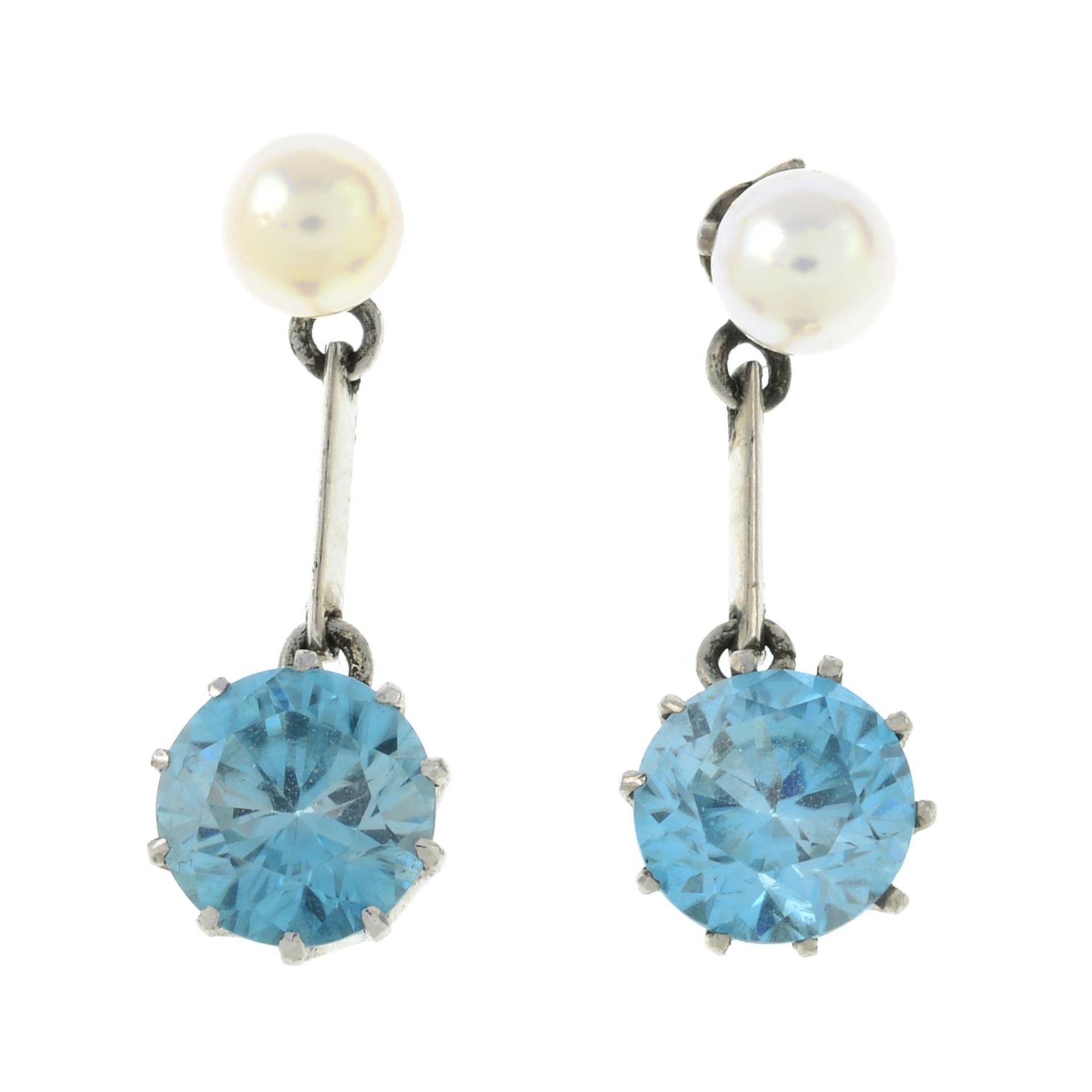 A pair of blue zircon and cultured pearl earrings.Length 2.4cms.