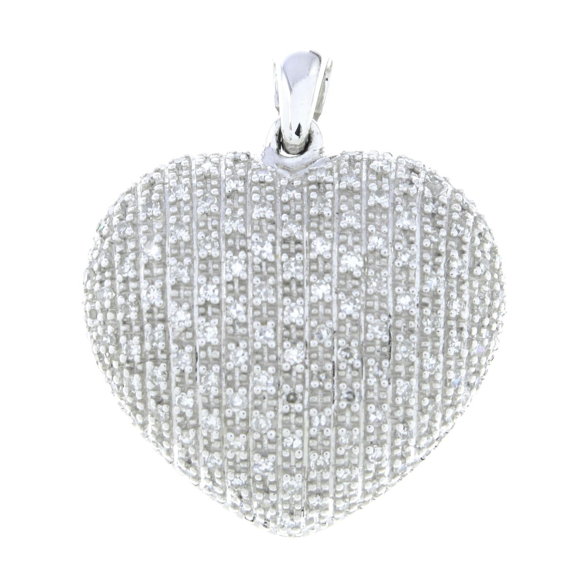 A 9ct gold diamond heart pendant.Total diamond weight 0.45ct, stamped to surmount.