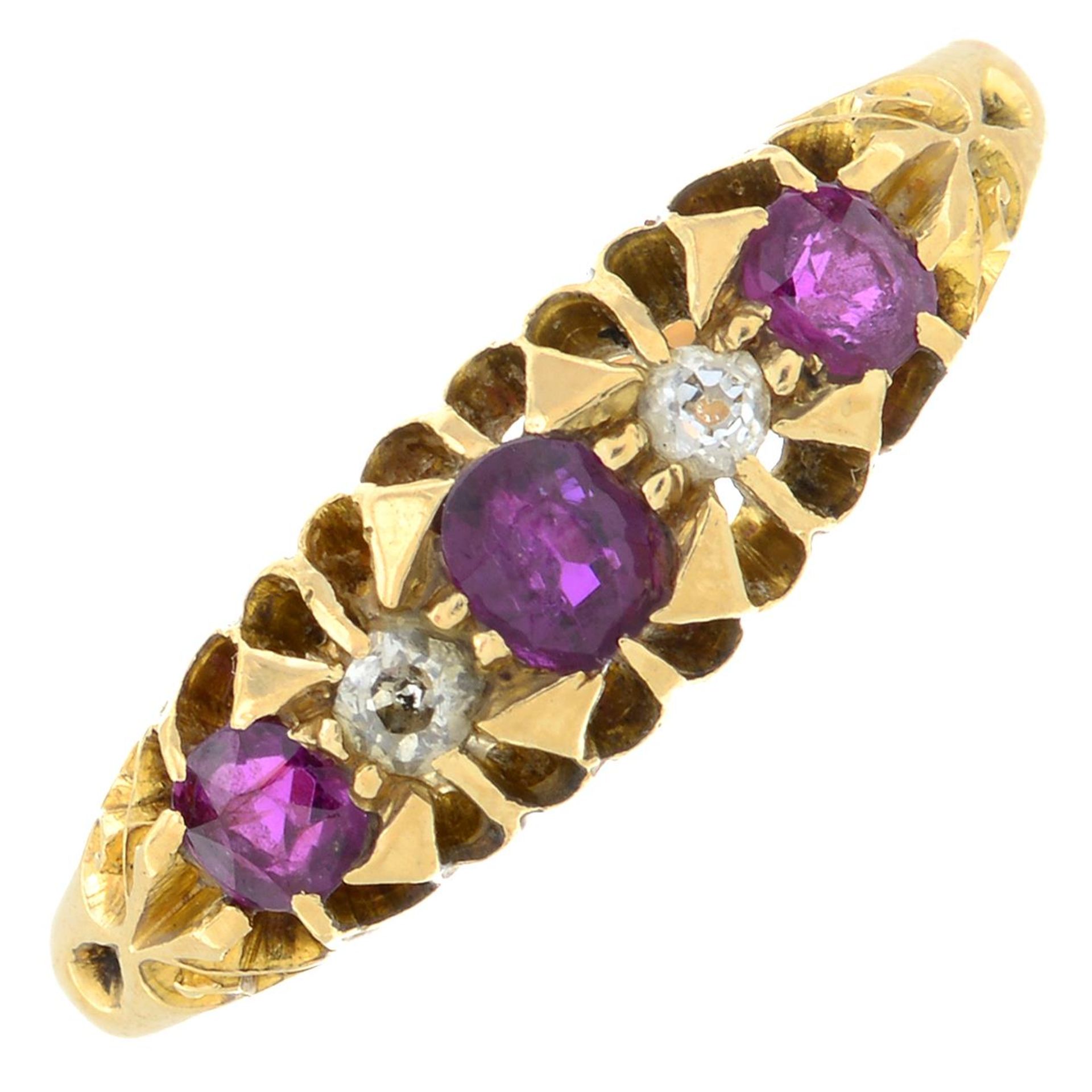 An 18ct gold ruby and diamond five-stone ring.Hallmarks for Birmingham.Ring size S.