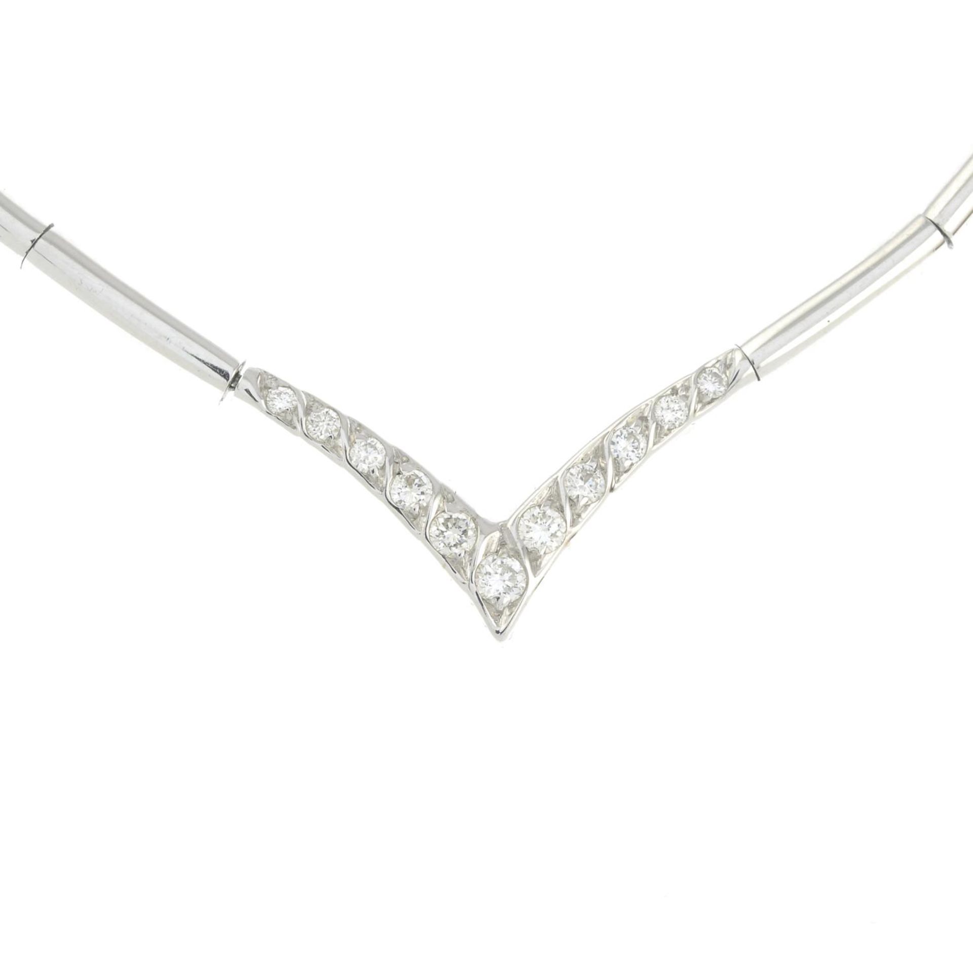 A collar, with brilliant-cut diamond highlights.Total diamond weight 0.24ct,