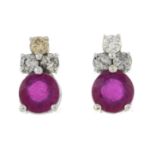 A pair of glass-filled ruby and brilliant-cut diamond earrings.Estimated total diamond weight