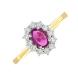 An 18ct gold ruby and diamond cluster ring.Ruby weight 0.50ct.