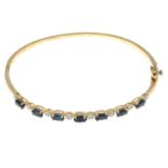 A 9ct gold sapphire and single-cut diamond bangle.Total diamond weight 0.12ct,