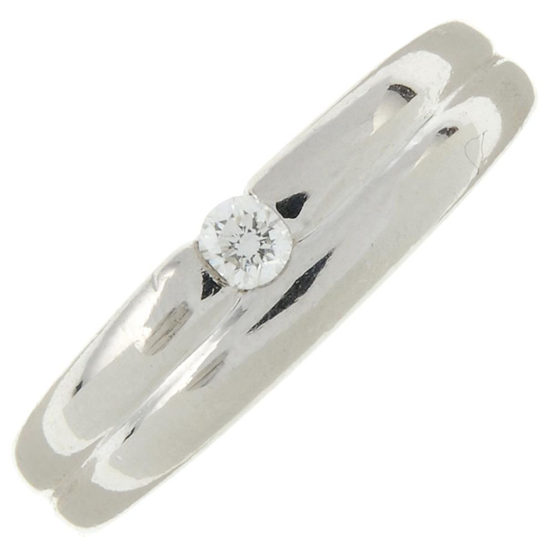 A platinum brilliant-cut diamond band ring.Diamond weight 0.12ct,