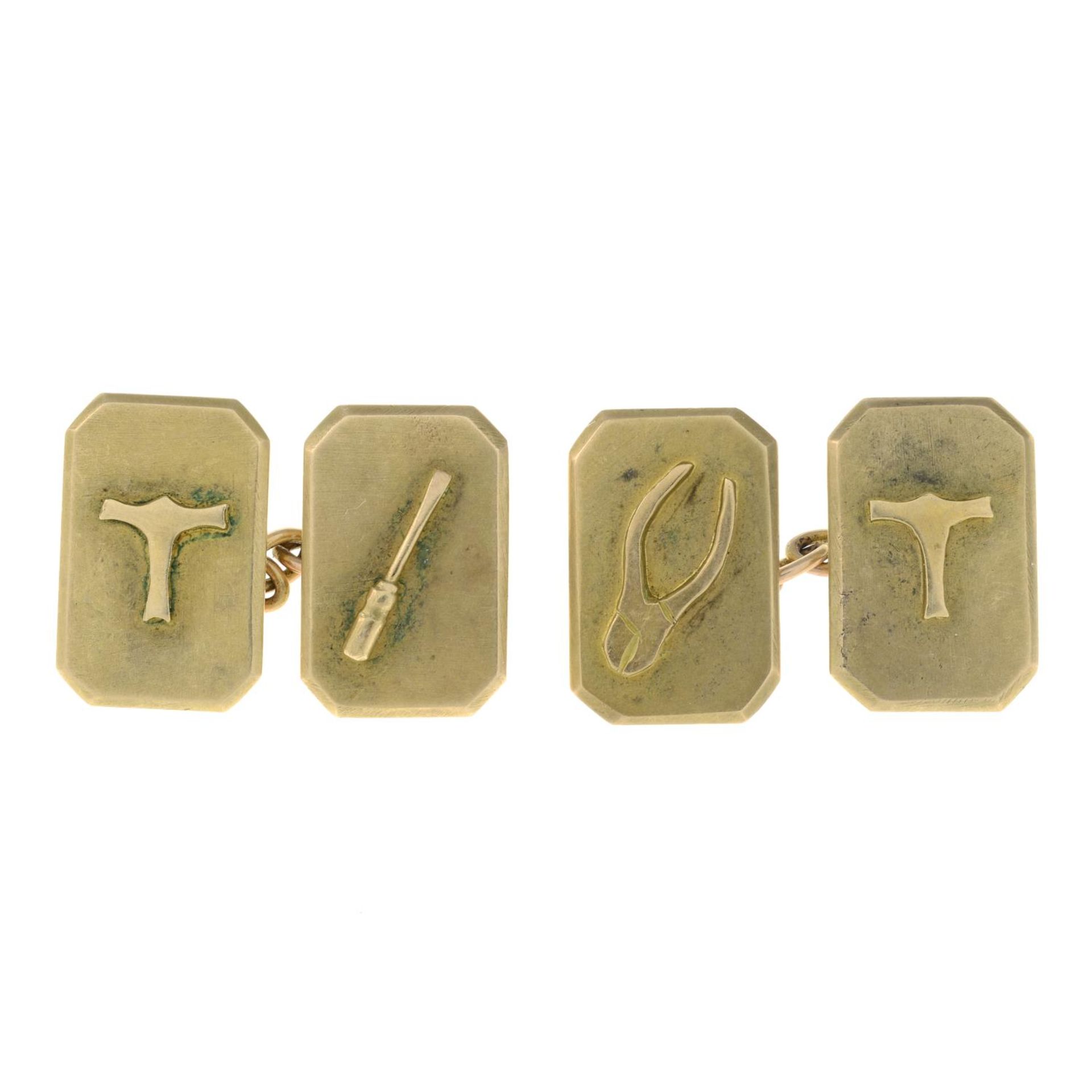 A pair of early 20th century 9ct gold tool motif cufflinks.Stamped 9ct.Length of cufflink face