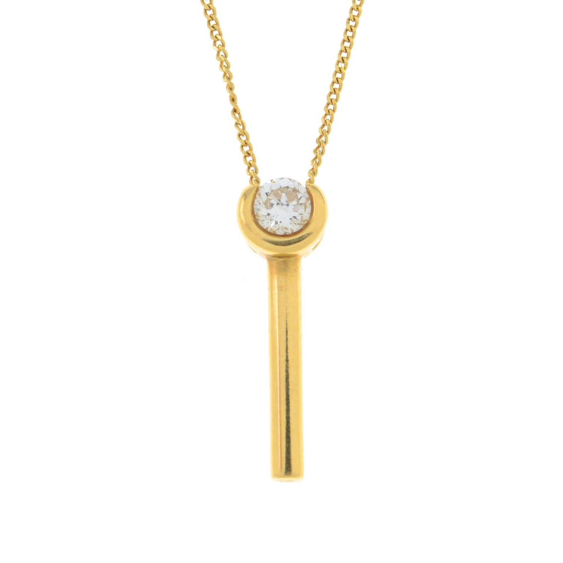 An 18ct gold diamond pendant,