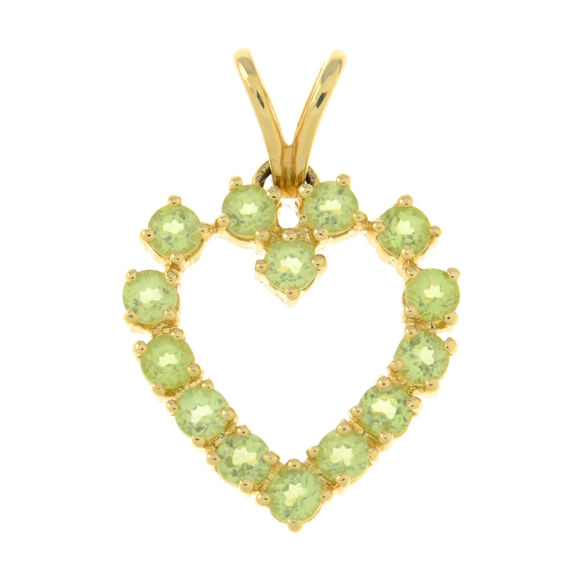 A chrysoberyl heart pendant.Stamped 585.Length 2.7cms.