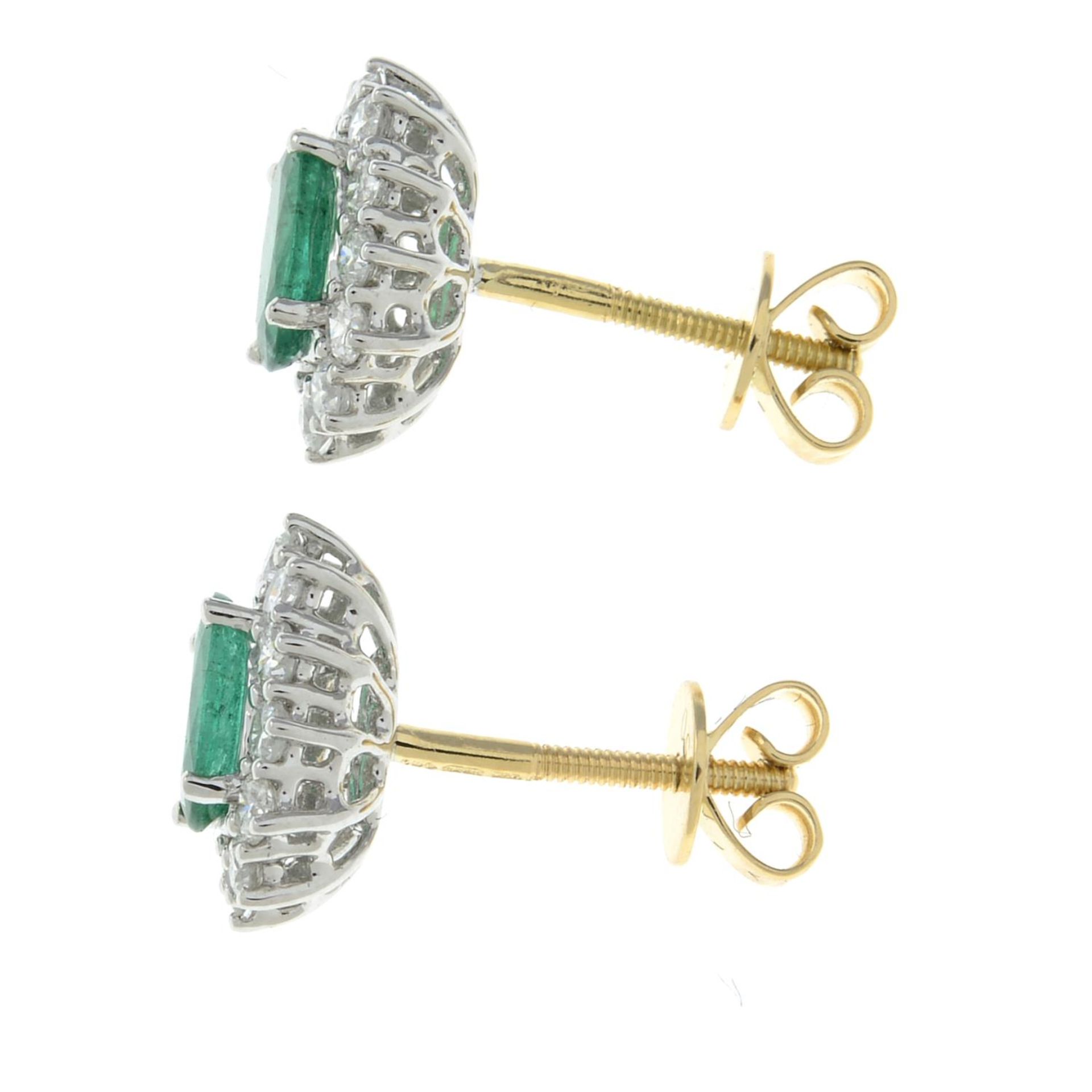 A pair of 18ct gold emerald and diamond cluster stud earrings.Total emerald weight 0.59ct. - Image 2 of 2