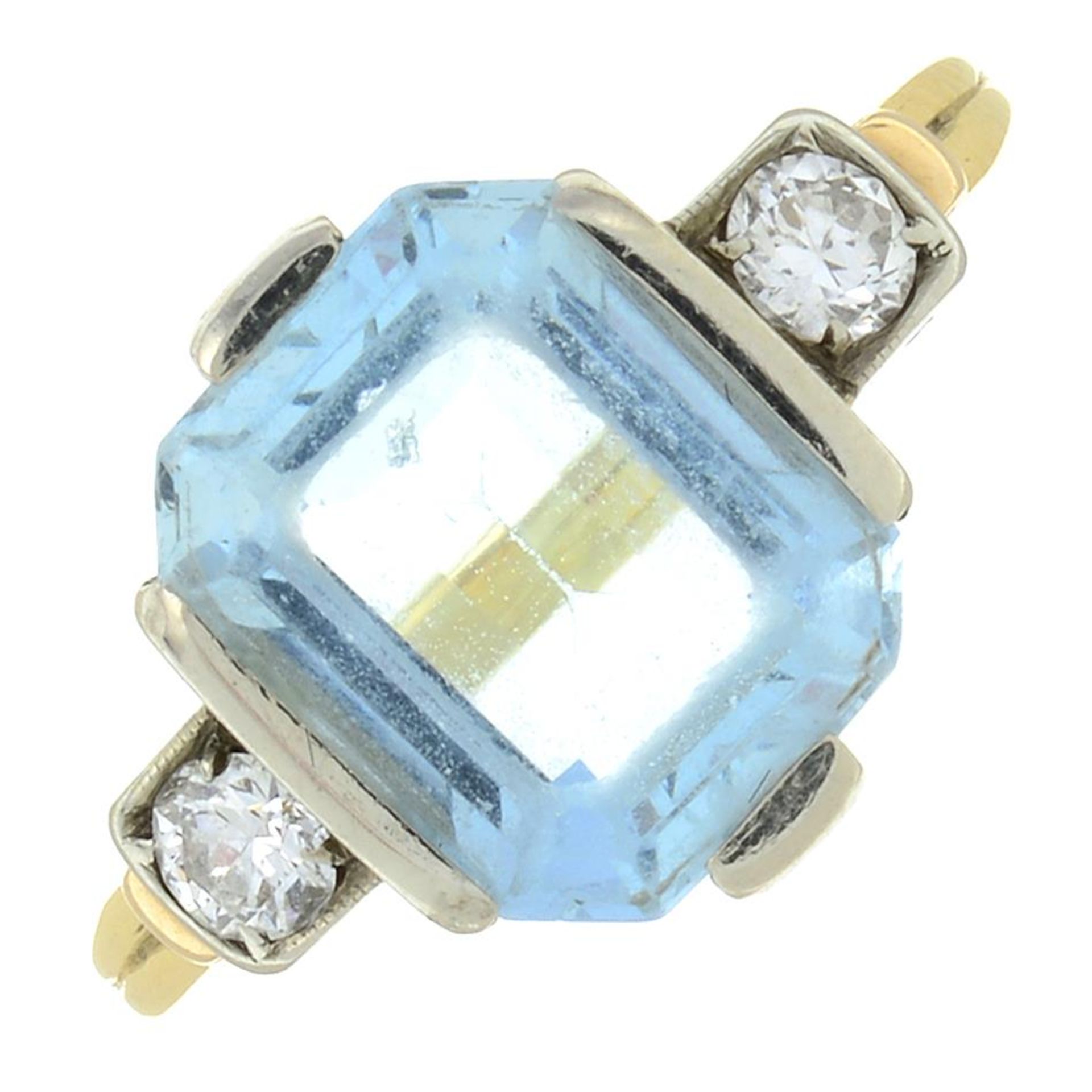 An aquamarine and brilliant-cut diamond three-stone ring.Aquamarine calculated weight 2.75cts,