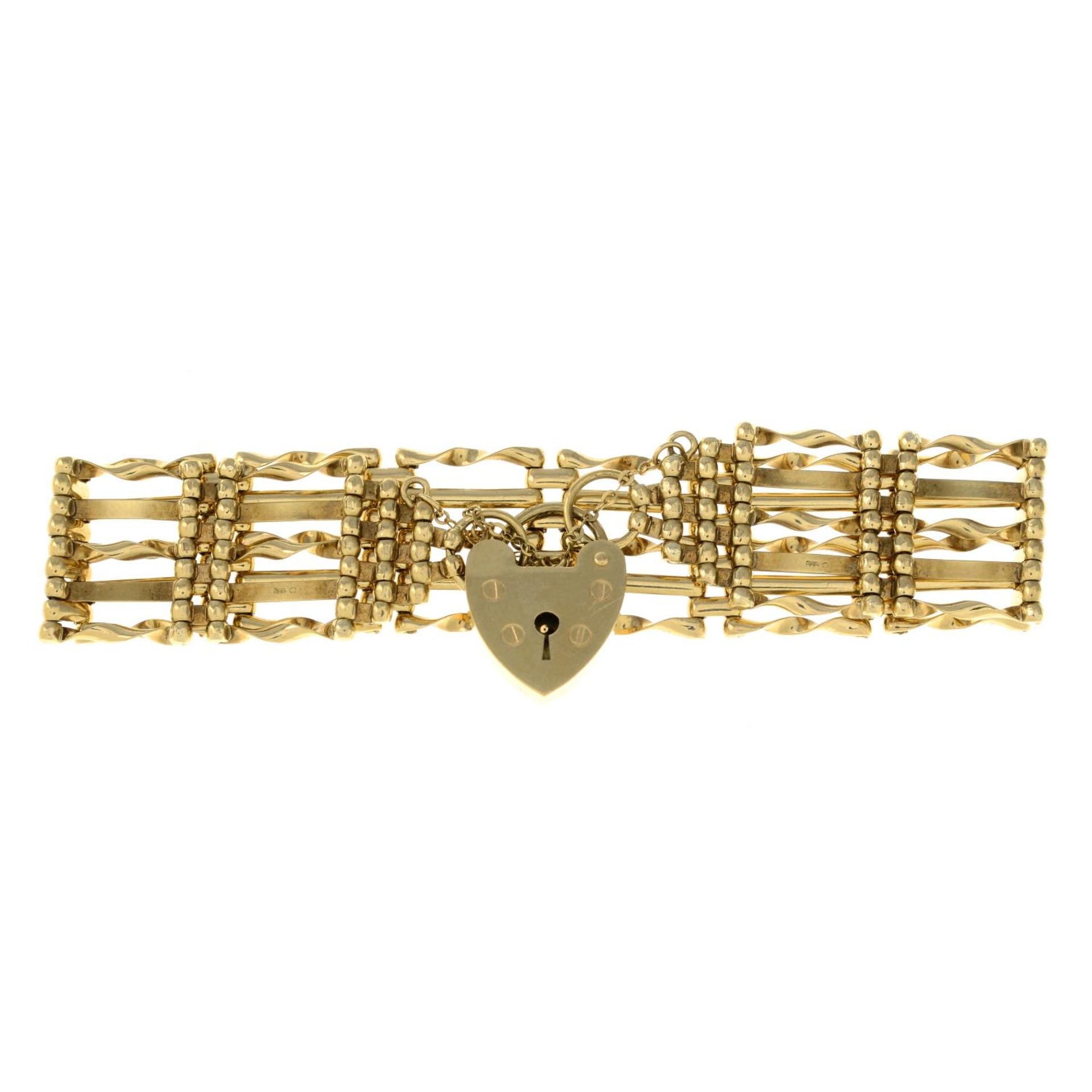 A 9ct gold gate-link bracelet, with heart padlock clasp.Hallmarks for London, 1976.Length 18cms.
