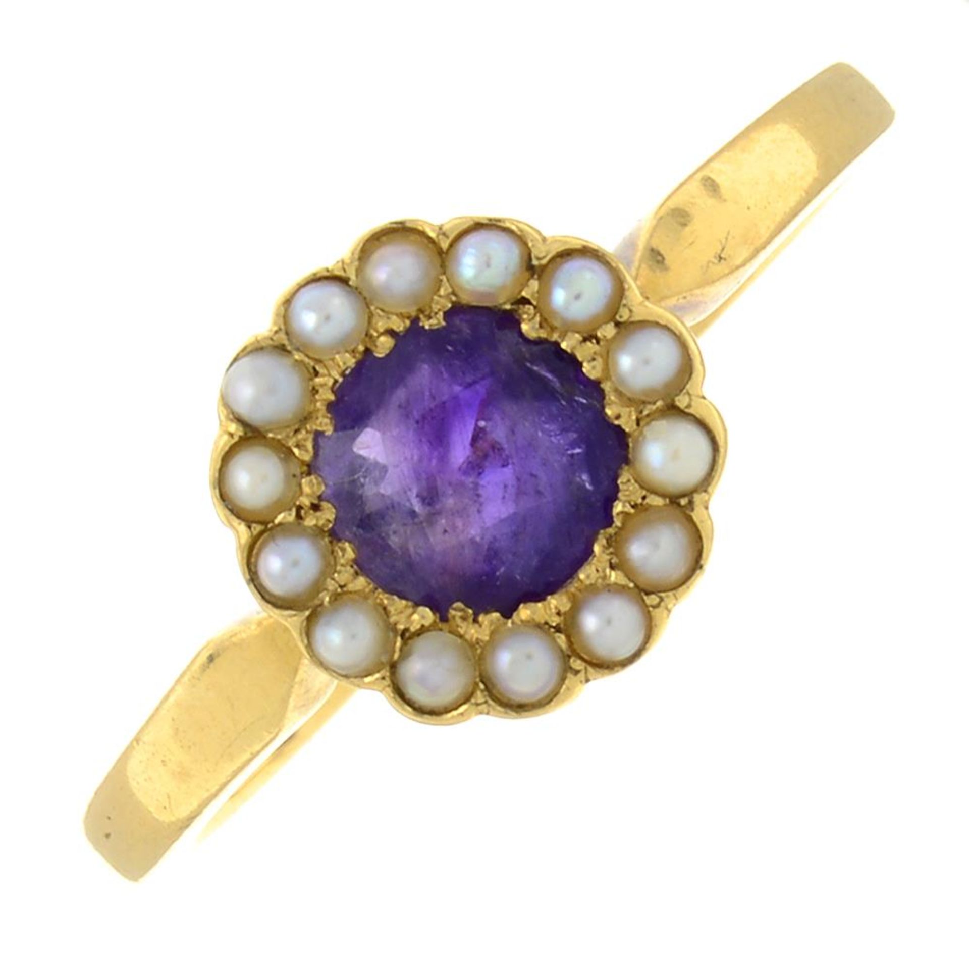 An amethyst and split pearl cluster ring.Stamped 18ct.Ring size N1/2.