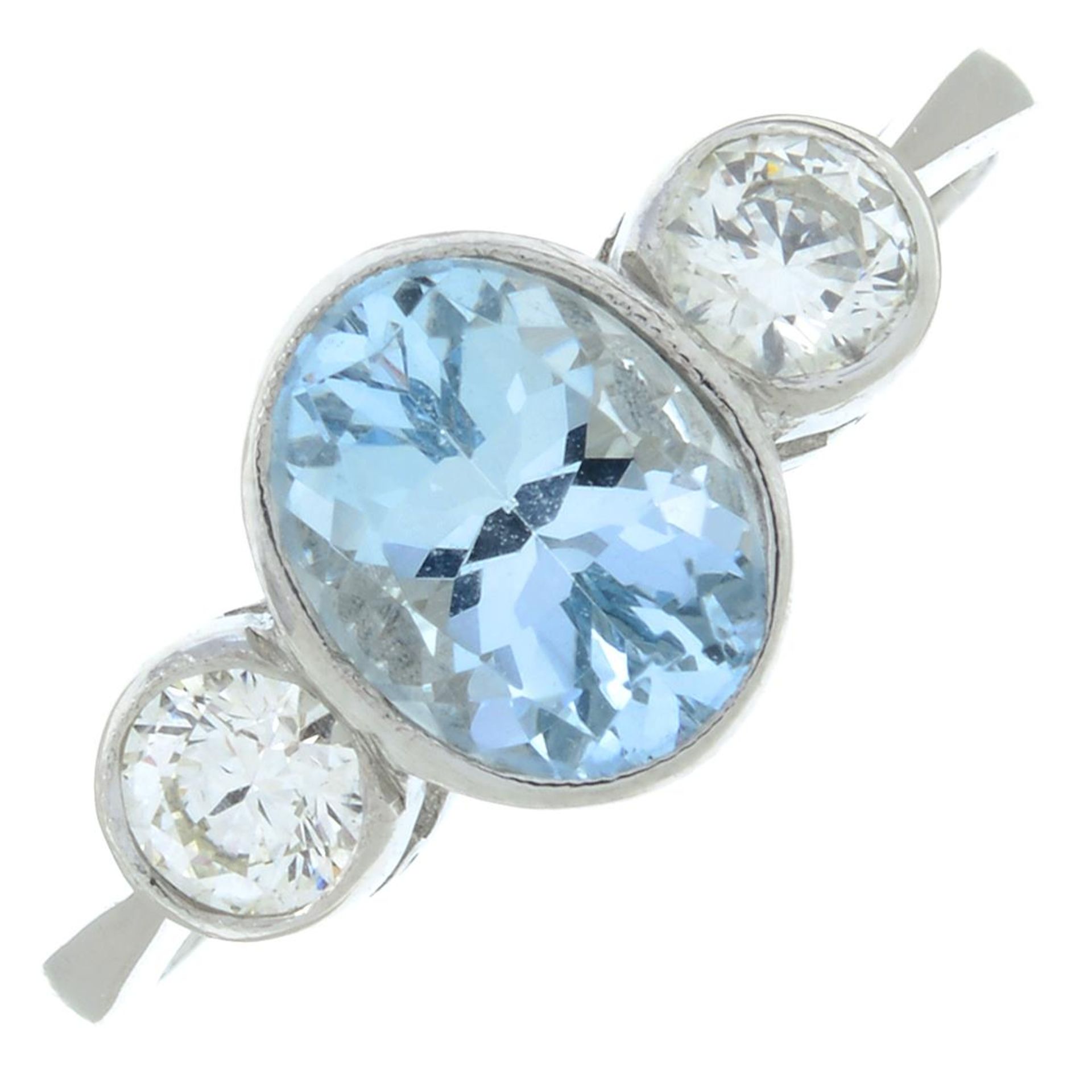 An aquamarine and diamond three-stone ring.Aquamarine calculated weight 1.07cts,