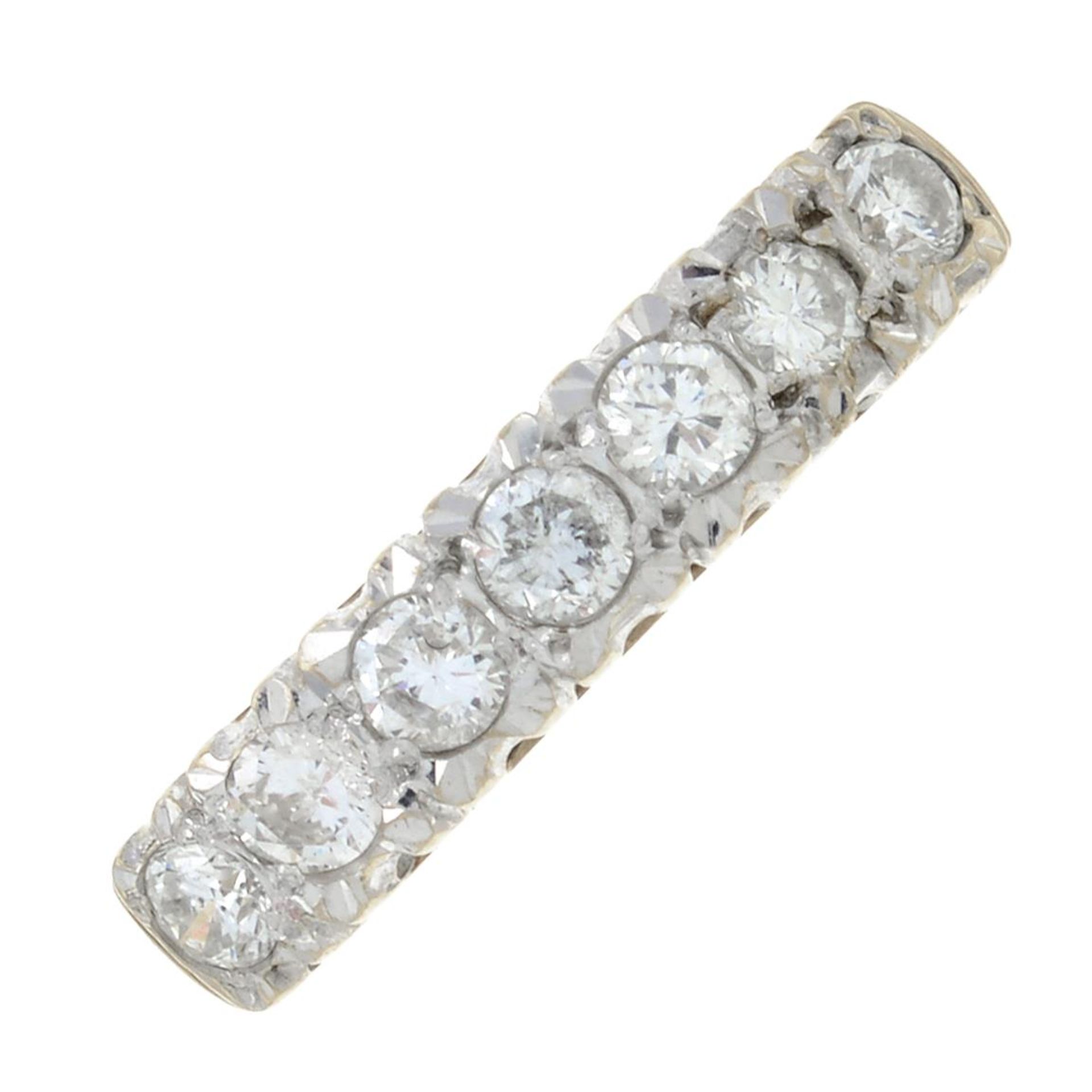 A 9ct gold diamond half-eternity ring.Total diamond weight 0.50ct, stamped to band.