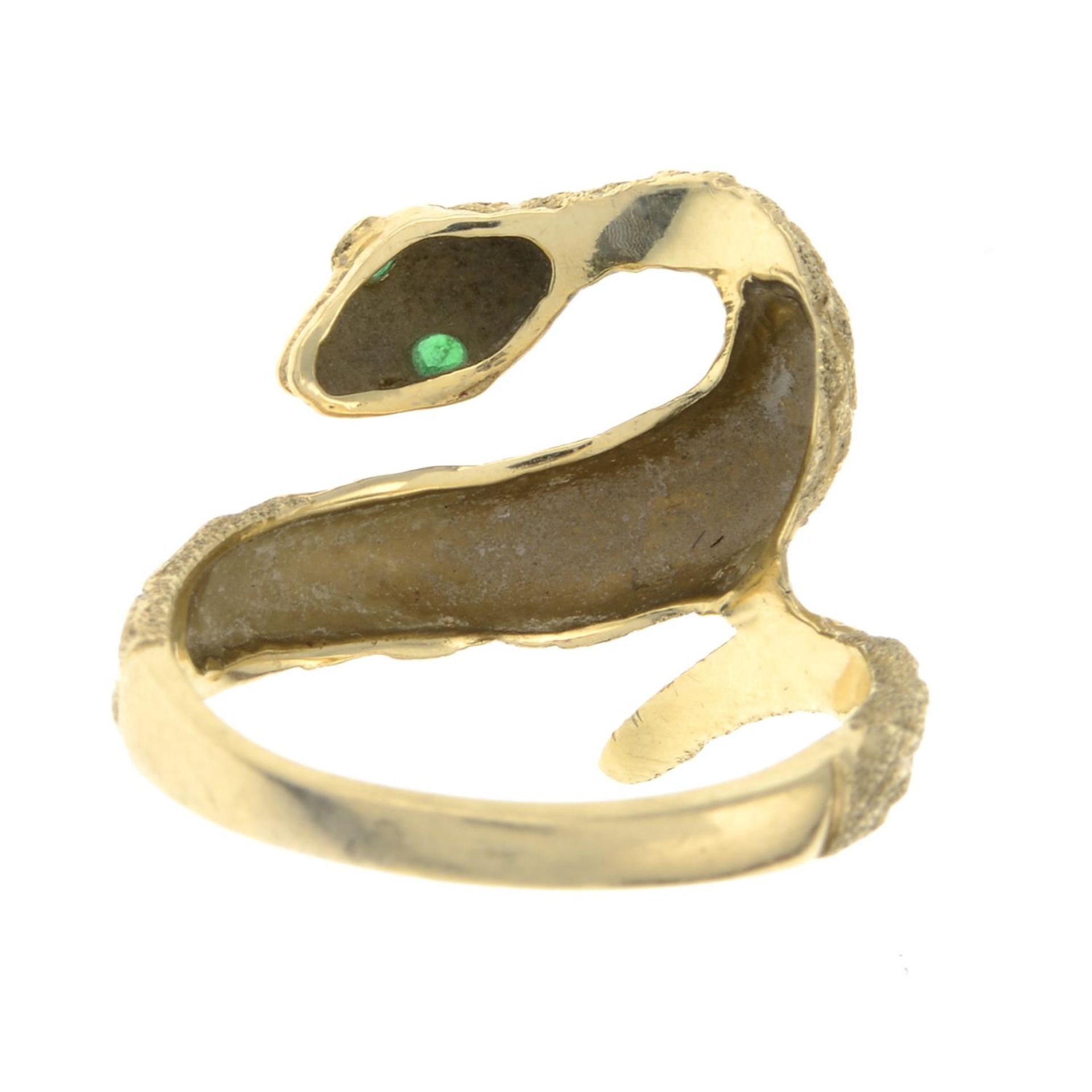 A snake ring, with emerald accents. - Image 2 of 2