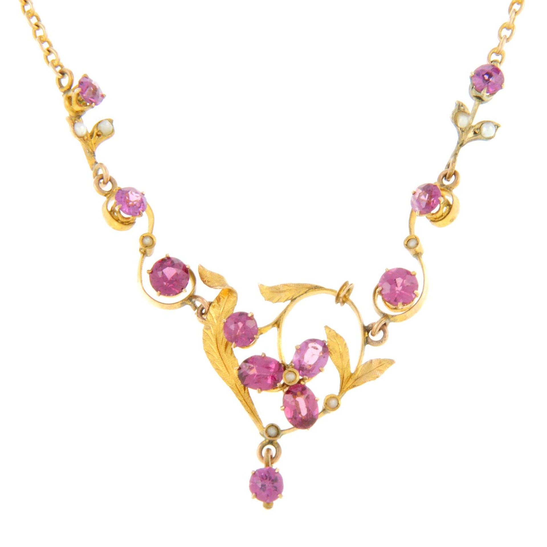 An early 20th century 9ct gold garnet and split pearl necklace.